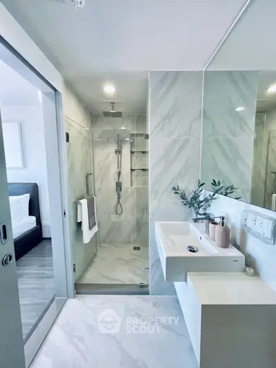 Modern bathroom with sleek shower and elegant marble tiles