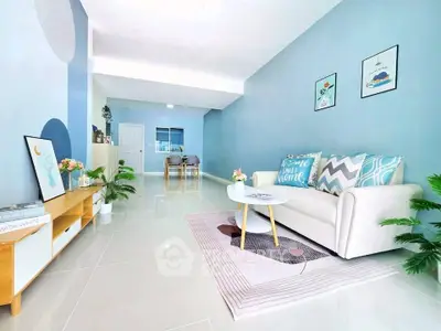 Stylish living room with modern decor and pastel blue walls