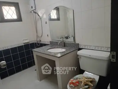 Modern bathroom with elegant sink and stylish tile design, perfect for a contemporary home.
