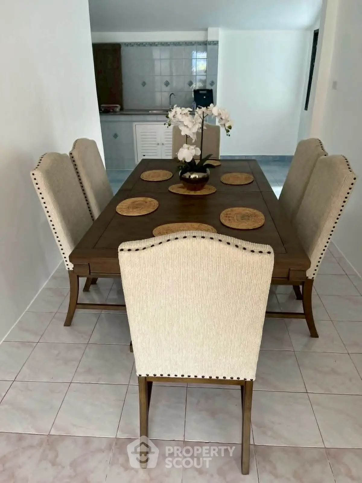 Elegant dining area with stylish table and chairs, perfect for family gatherings in a cozy home setting.