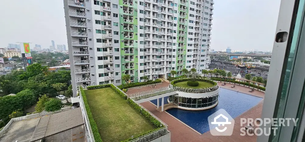 Stunning high-rise apartment with pool and city view, perfect for urban living.