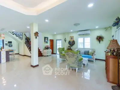 Spacious and elegant living room with stylish decor and natural light