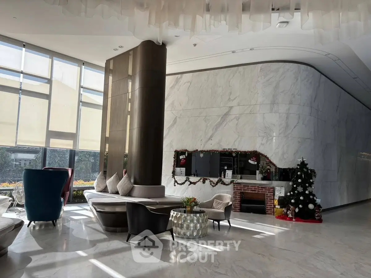 Luxurious modern lobby with elegant seating and festive decor