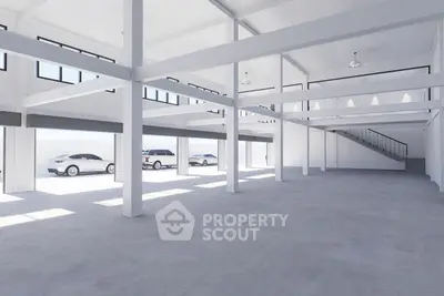 Spacious modern warehouse interior with high ceilings and ample natural light.