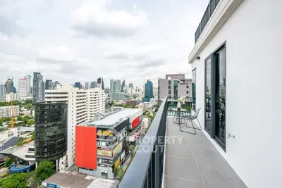 Stunning cityscape view from a modern high-rise balcony, perfect for urban living.