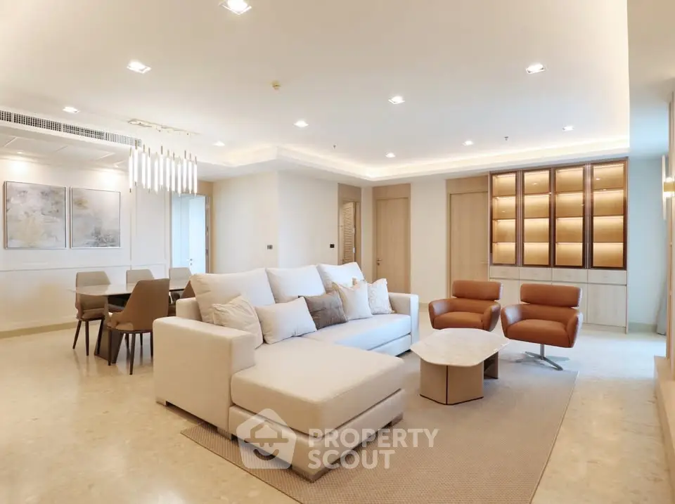 Luxurious modern living room with elegant furniture and ambient lighting, perfect for relaxation and entertainment.