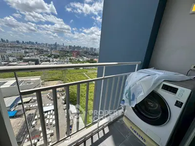 High-rise balcony with city view and washing machine, perfect urban living.