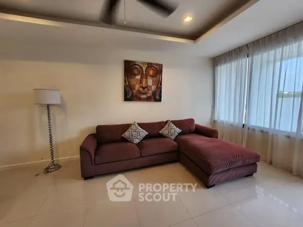 Spacious living room with modern sofa and elegant decor