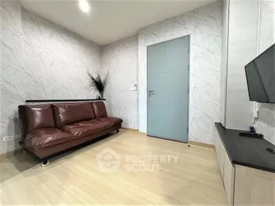 Modern living room with sleek brown leather sofa and minimalist decor