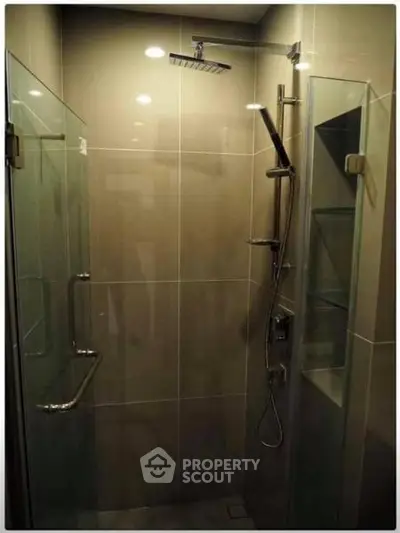 Modern bathroom shower with glass enclosure and sleek fixtures
