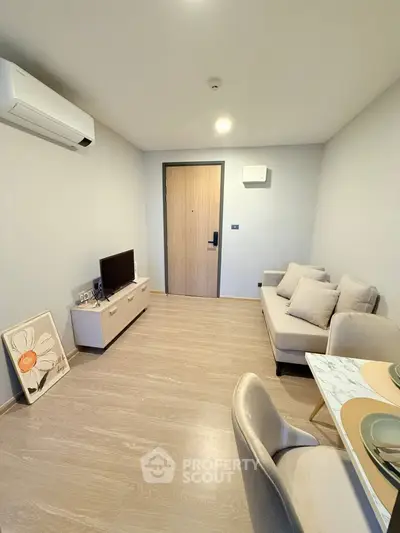 Modern living room with minimalist decor and air conditioning