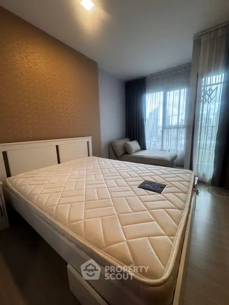 Modern bedroom with large window and stylish decor