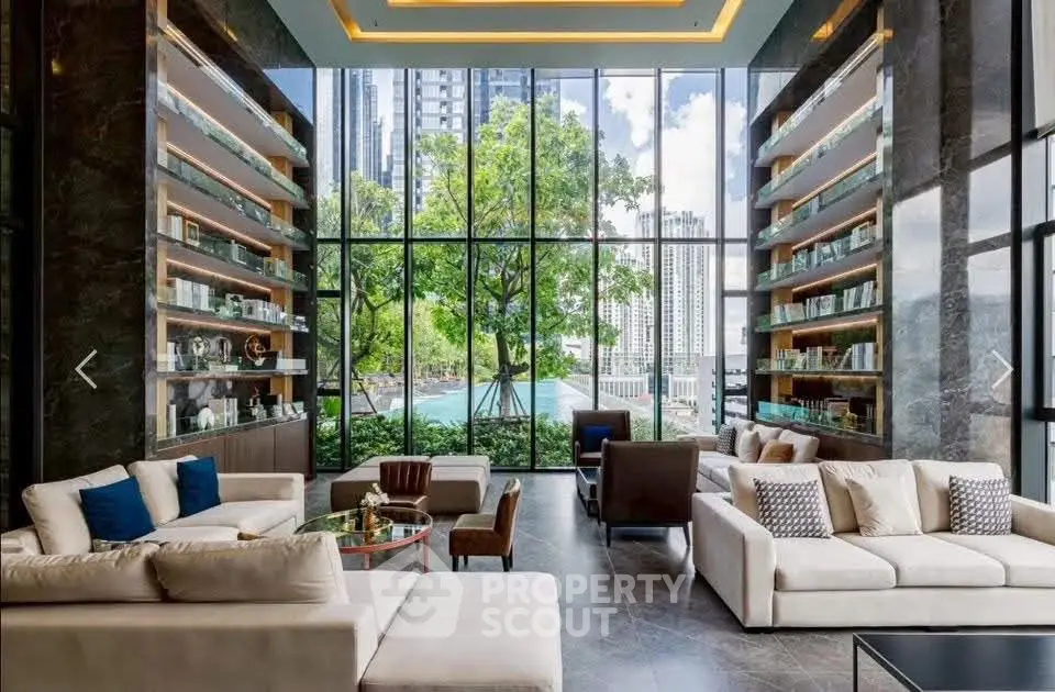 Luxurious modern living room with floor-to-ceiling windows and stunning city view, featuring elegant sofas and stylish decor.