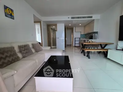 Spacious modern living room with open kitchen and stylish decor