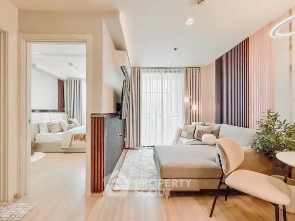 Modern open-plan living room with stylish decor and natural light