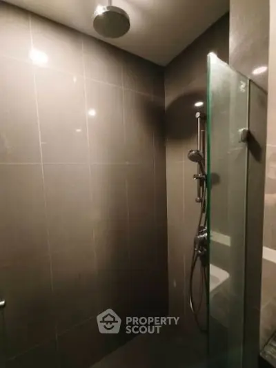 Modern bathroom with sleek shower design and glass partition