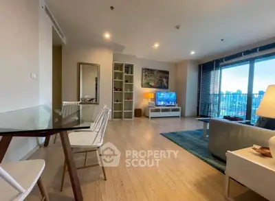 Spacious modern living room with city view and stylish decor