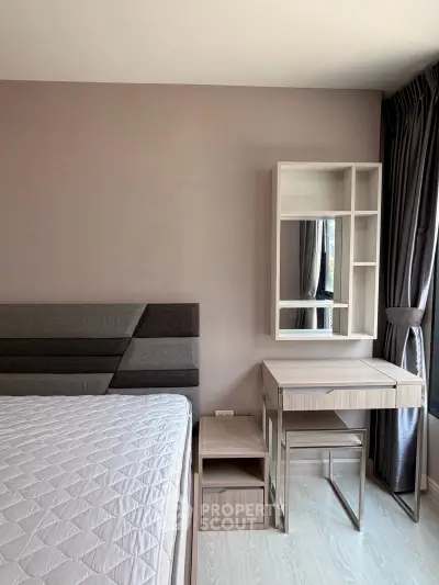 Modern bedroom with stylish furniture and natural light, perfect for a cozy living experience.