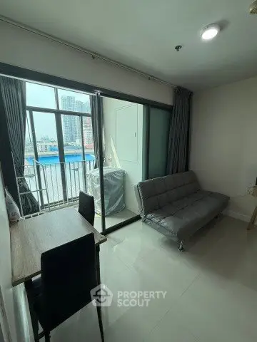 Modern living room with balcony view in urban apartment