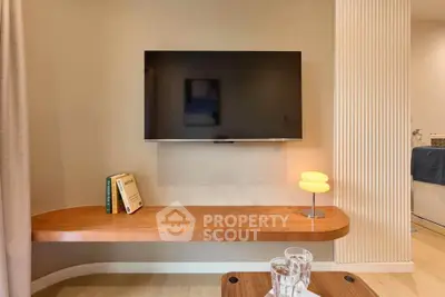 Modern living room with mounted TV and stylish wooden shelf