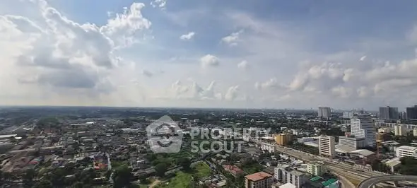 Stunning panoramic cityscape view showcasing urban skyline and sprawling neighborhoods under a vibrant sky.