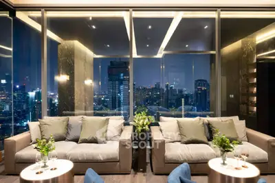 Luxurious living room with stunning city view, modern decor, and elegant lighting in high-rise apartment.