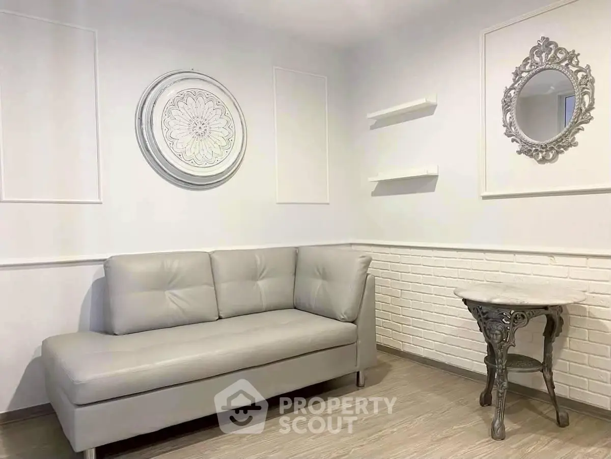 Chic modern living room with elegant gray sofa and stylish decor accents.