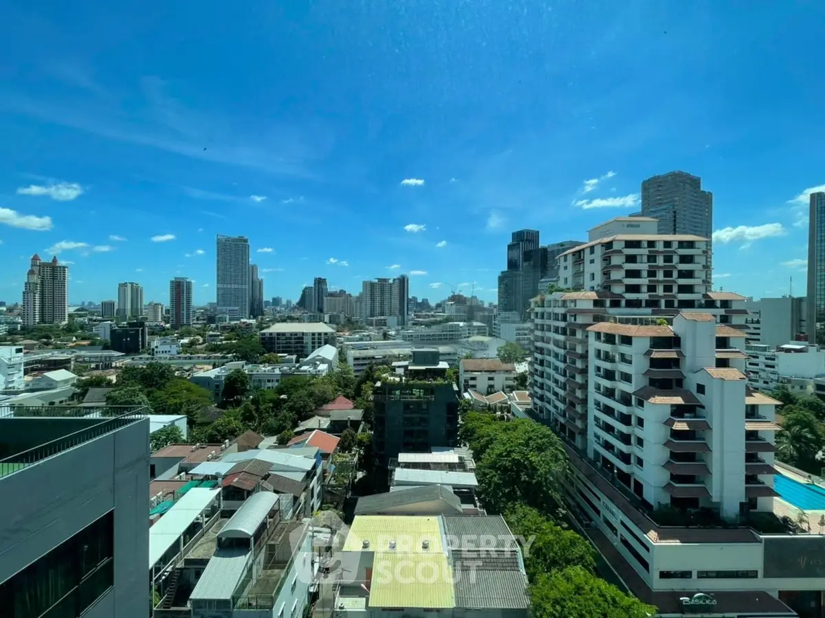 Stunning cityscape view showcasing modern high-rise buildings under a clear blue sky.