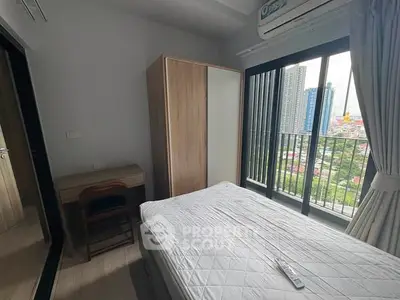 Modern bedroom with balcony view in high-rise apartment