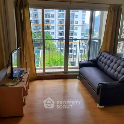 Bright living room with balcony view in modern apartment