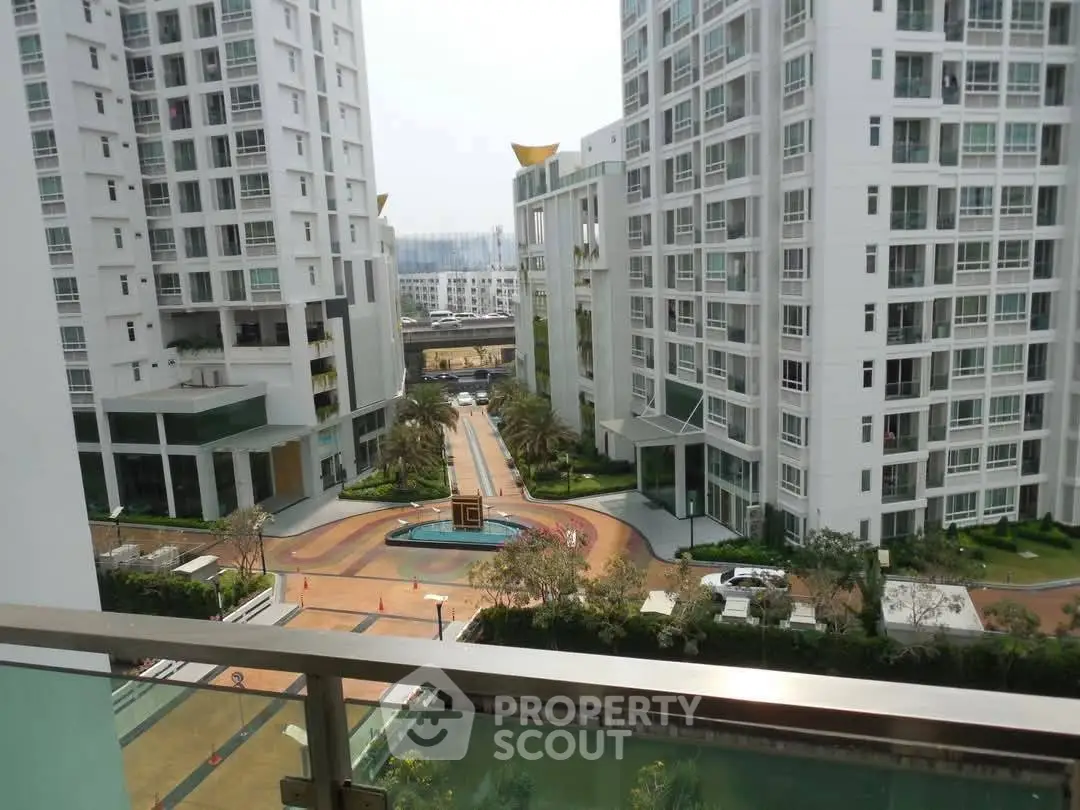 Luxurious high-rise apartment complex with stunning garden views and modern architecture.