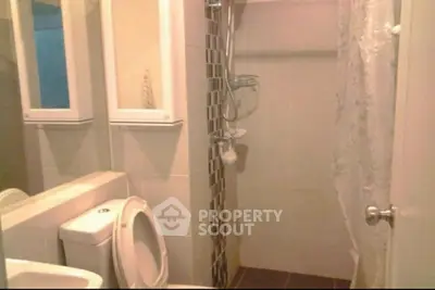 Compact bathroom with shower and modern fixtures