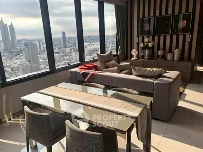 Luxurious high-rise living room with panoramic city views and elegant decor.