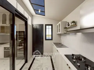 Modern kitchen with sleek design, skylight, and gas stove in a bright, airy space.