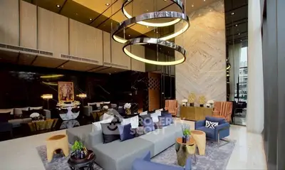 Luxurious modern living room with high ceilings and elegant decor