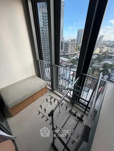 Modern high-rise balcony with stunning city view and sleek railing design.