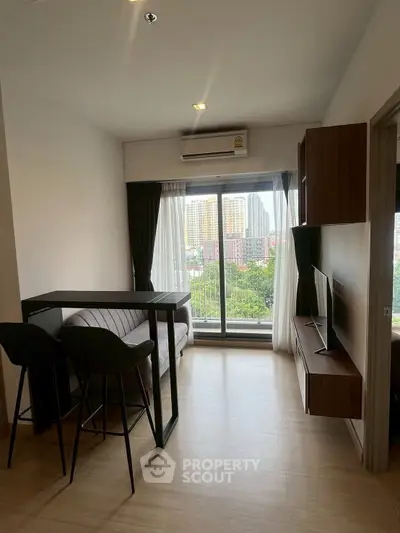 Modern living room with balcony view in high-rise apartment