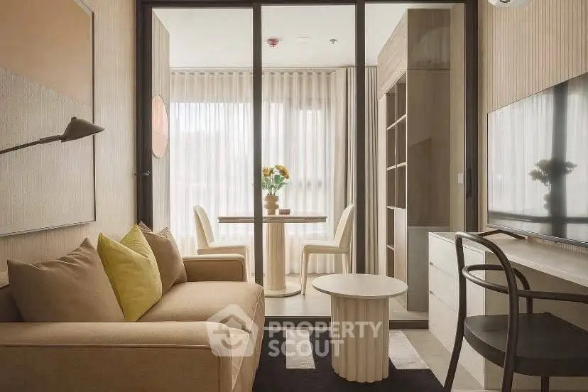Stylish living room with modern decor and dining area in cozy apartment.