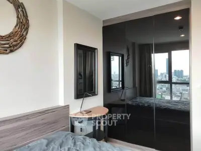 Modern bedroom with city view and stylish decor in high-rise apartment