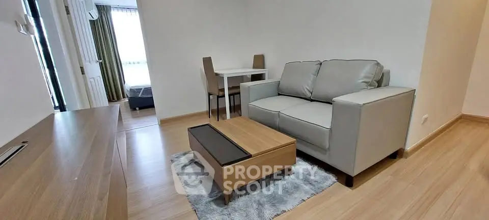 Modern living room with cozy sofa and stylish wooden furniture