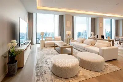 Luxurious modern living room with panoramic city views and elegant furnishings.