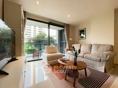 Spacious living room with modern decor and balcony view