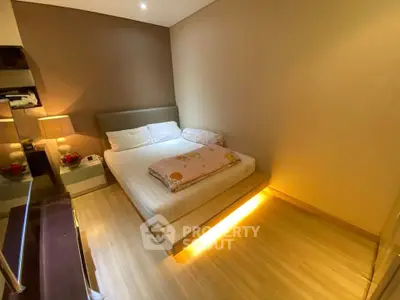 Cozy bedroom with modern lighting and elegant decor