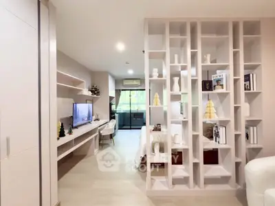 Modern open-plan living room with stylish partition and natural light