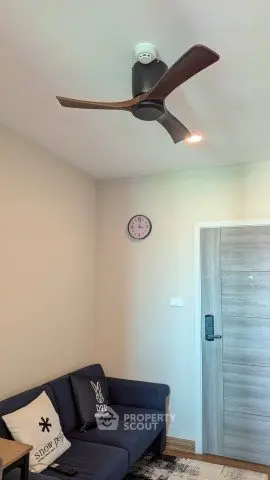 Cozy living room with modern ceiling fan and stylish decor
