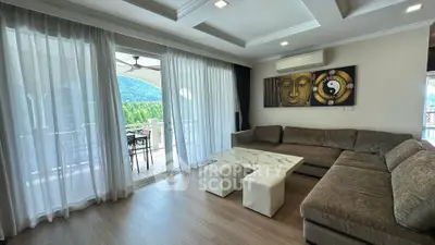 Spacious living room with modern decor and balcony view