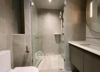 Modern bathroom with glass shower and sleek fixtures