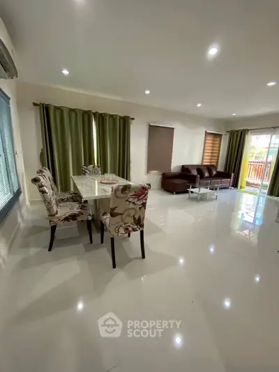 Spacious living room with elegant dining area and modern decor