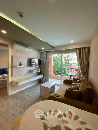 Stylish living room with modern decor and balcony view
