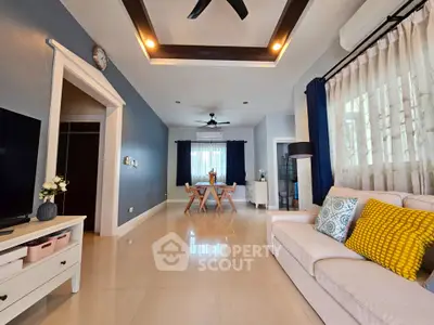 Spacious living room with modern decor and natural light